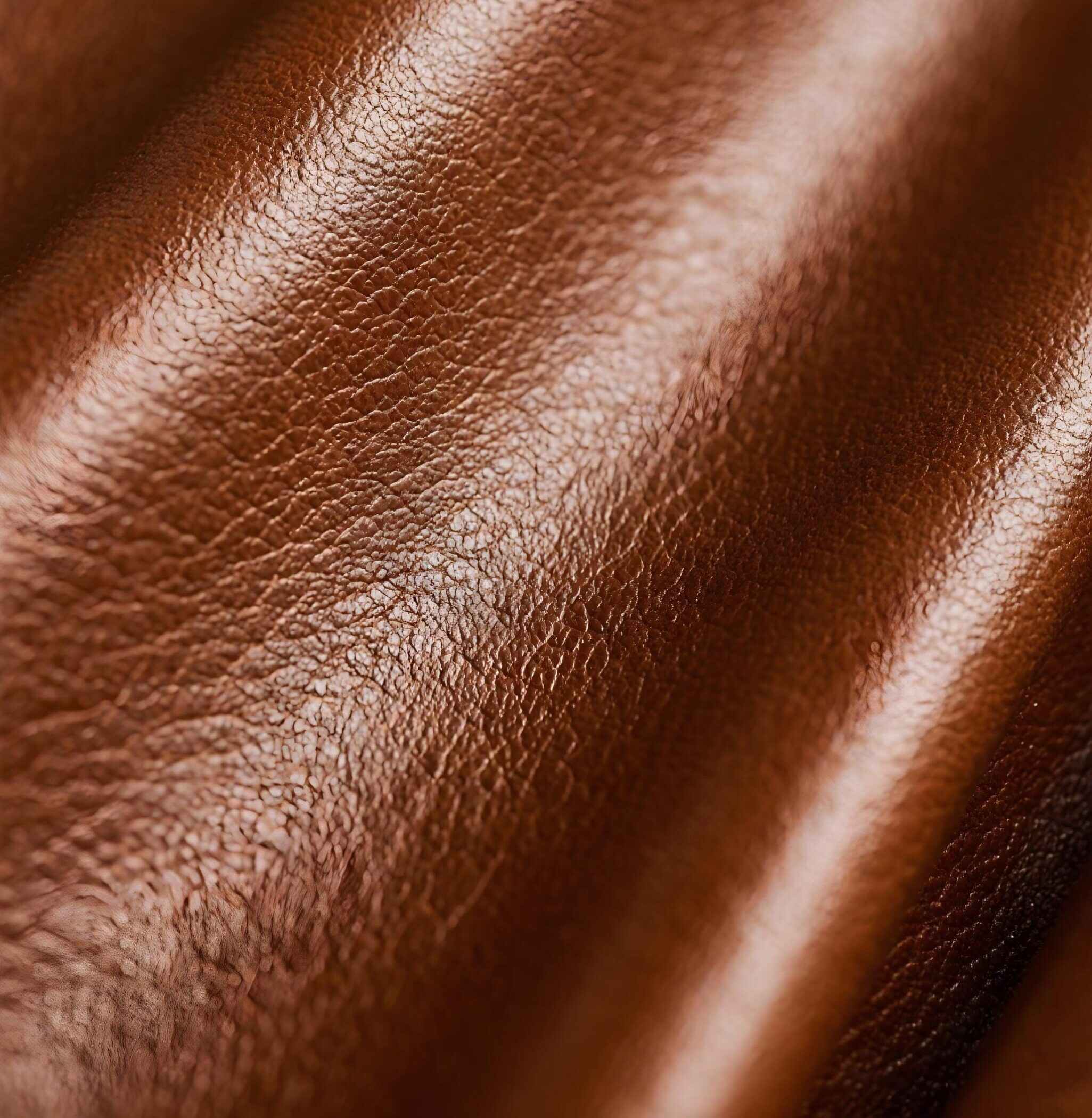 Close-up of smooth brown leather texture